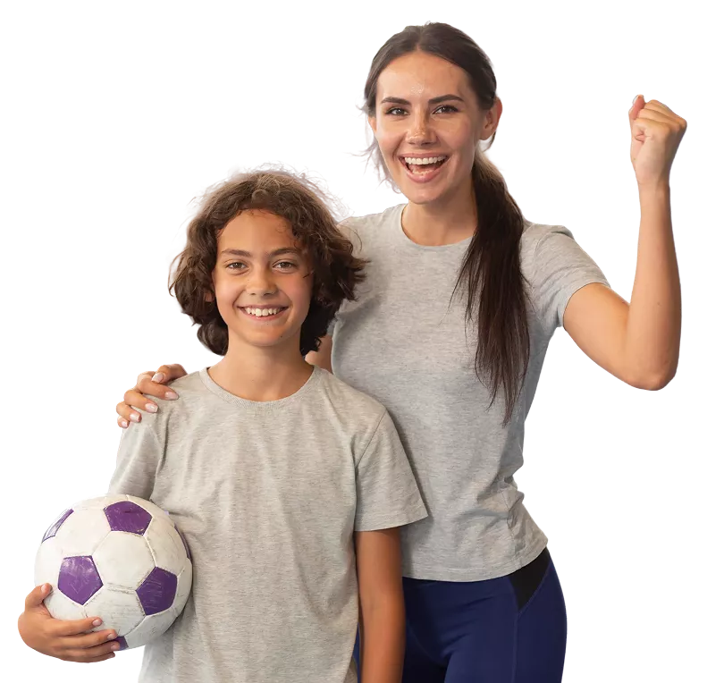 Coach and student holding a football